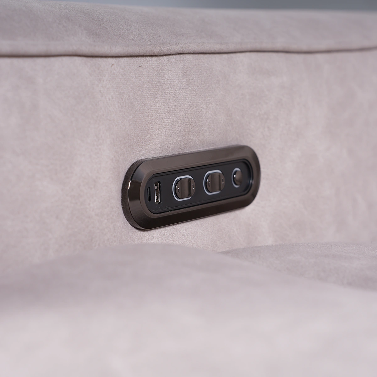Close-up of side control panel featuring built-in smart charging hub with USB-A and Type-C ports.
