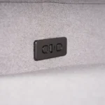 Close-up of side power control buttons with integrated fast-charging USB ports.