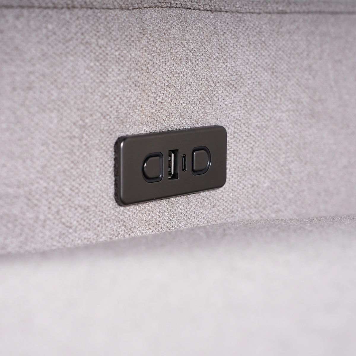 Close-up of side power control buttons with integrated fast-charging USB ports.