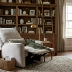 3D lifestyle rendering of Rowan fabric power recliner armchair in a modern executive study and home library.