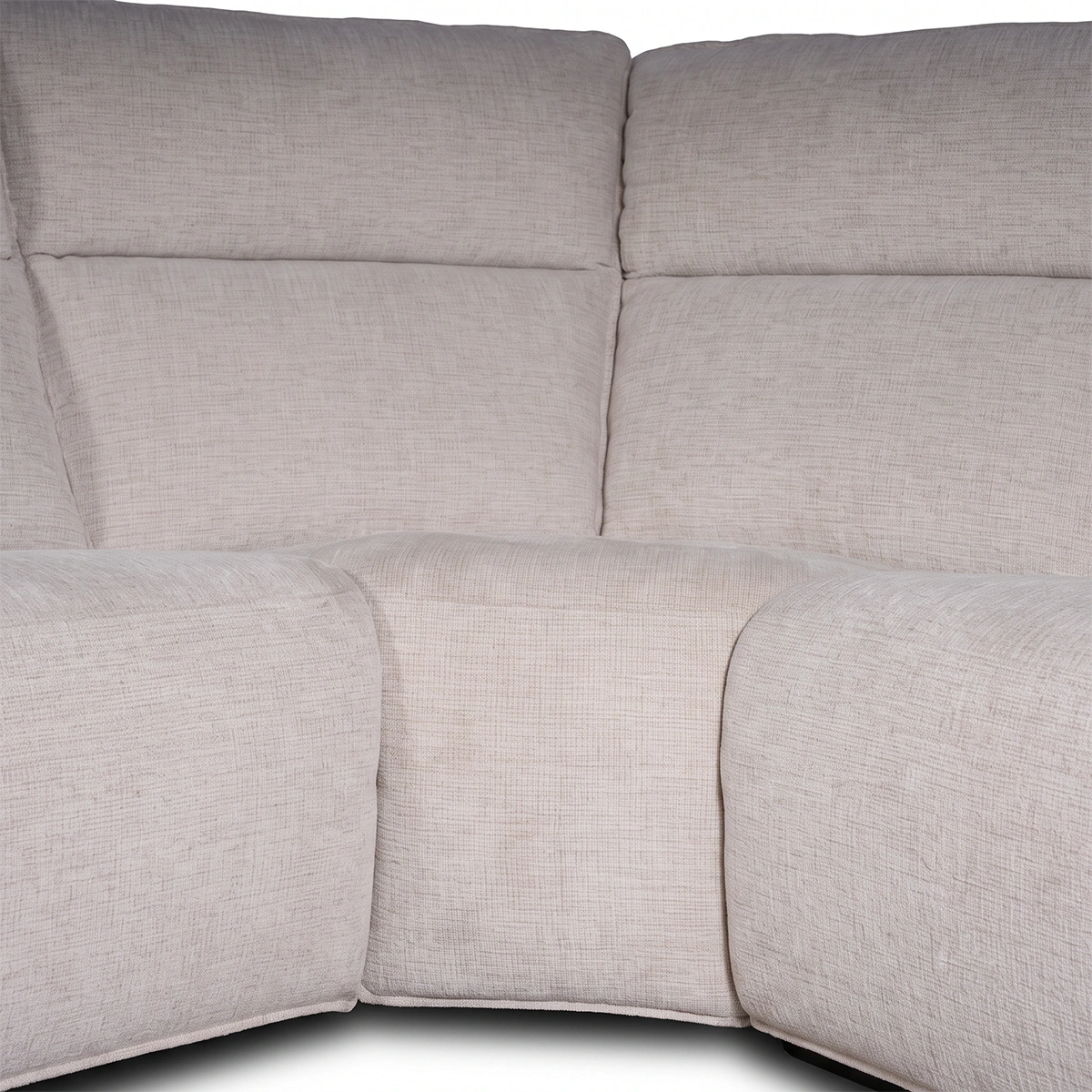 Close-up angle of the seamless curved corner wedge module on Stirling sectional sofa.