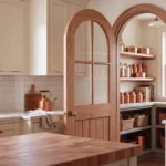 True Radius Arch 4-Lite Planked interior door installed in a luxury transitional living and dining space