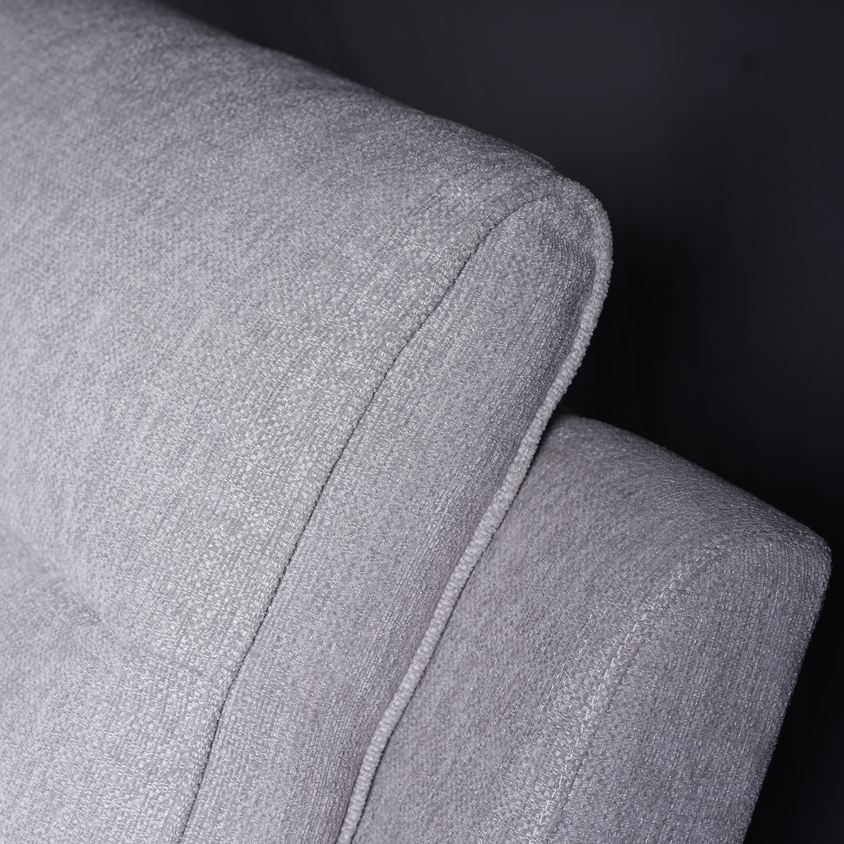 Close-up of ergonomic tiered channel backrest showing segmented lumbar and neck support.